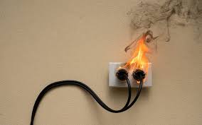 Electrical fire hazard from overloaded wall socket in a professional workplace environment - Kirby Fire Safety